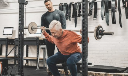 elerly person lifting weights Calgary Personal Training Gym | Calgary Personal Trainer